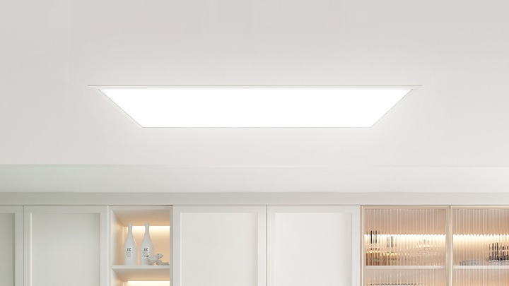 Top view of man and woman preparing dinner in well-lit kitchen