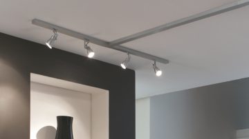 Hallway spot lights highlighting a nice vase
