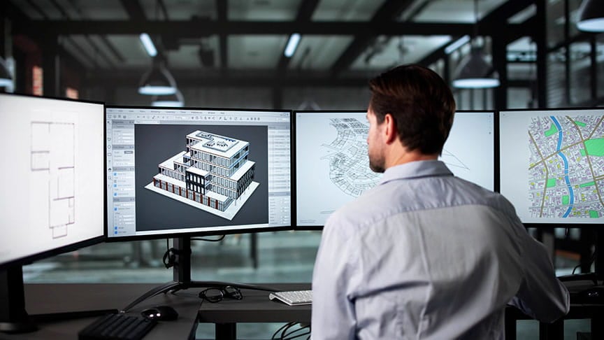 Person working at computer with technical drawings