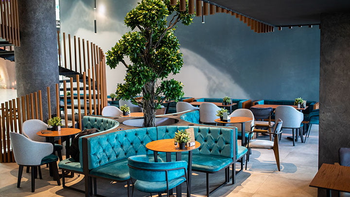 Cafe with teal seating and warm ambient lighting
