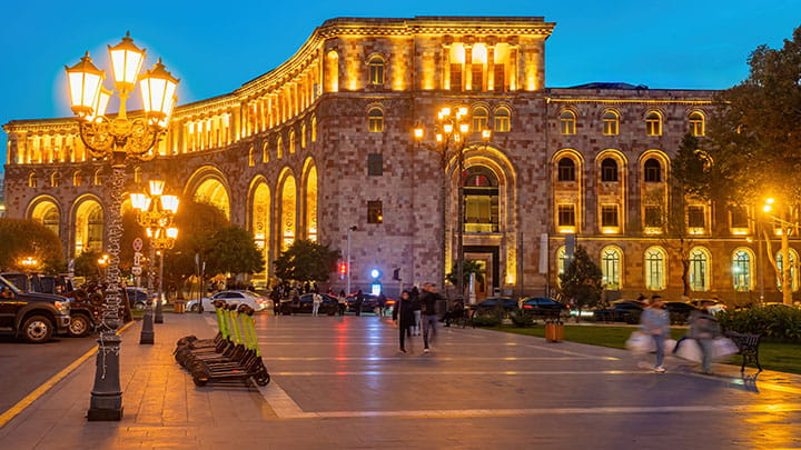 City square at night with warm outdoor lighting