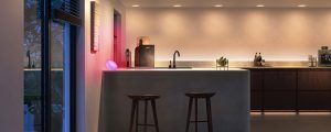 A kitchen counter lit in bright white tones of smart light.