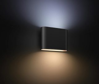 A Philips Hue outdoor wall light shining in warm and cool tones of light simultaneously. 