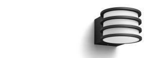 Round outdoor wall light with a cylindrical shape, black matte finish, and layered rings over a white diffuser, no visible switches.