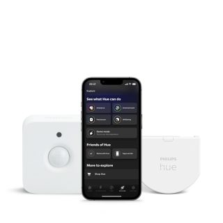 A collection of white smart motion sensor, smart security device with matte finish, and a smartphone displaying app interface.
