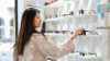 Woman browsing products in modern retail store