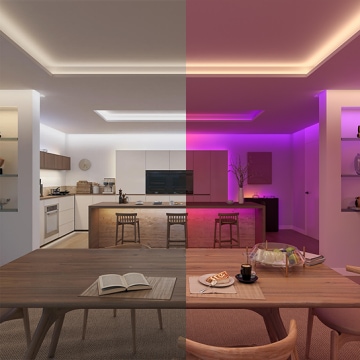 A split screen photo of a kitchen with one half showing the space lit with a wall washing effect in white light and the other half showing the space lit in pink and blue light.