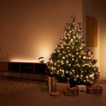 A Christmas tree wrapped in smart Festavia lights
