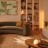 A living room decorated in neutral colours and lit with white light.