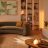 A living room decorated in neutral colors and lit with white light.