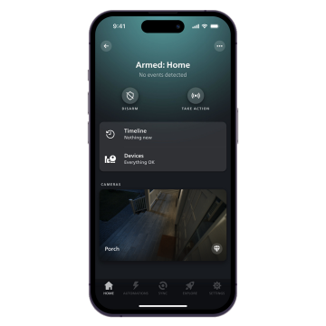 A smartphone displaying a home security app interface with status ""Armed: Home,"" disarm and take action buttons, and porch camera feed.