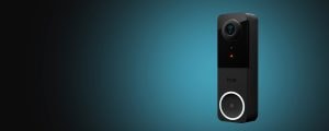 Rectangular black video doorbell with a circular button, camera lens, matte and glossy finish, and bell icon on the button.
