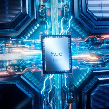 Rectangular silver processor labeled ""hue Bridge pro"" with a brushed metal finish, centered on a circuit board.