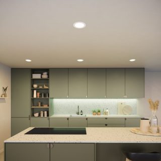 Ceiling recessed lights installed above a kitchen countertop, emitting bright illumination onto cabinets and workspace below.