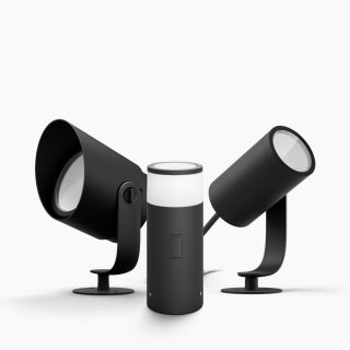 A set of black outdoor smart lamps with cylindrical shapes and similar design, placed against a plain white background.