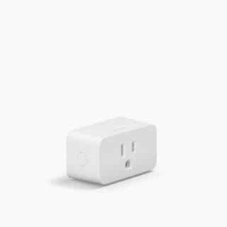 White rectangular smart plug with rounded edges, a visible power button on the side, and a standard outlet on the front.