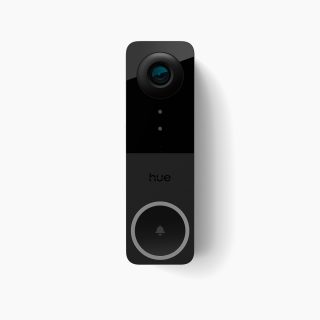 Rectangular black video doorbell with a glossy finish, camera lens at the top, circular button with bell icon, and visible ""hue"" text.