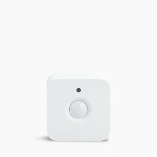 White compact square smart security motion sensor with rounded edges, matte finish, visible sensor and indicator on front.